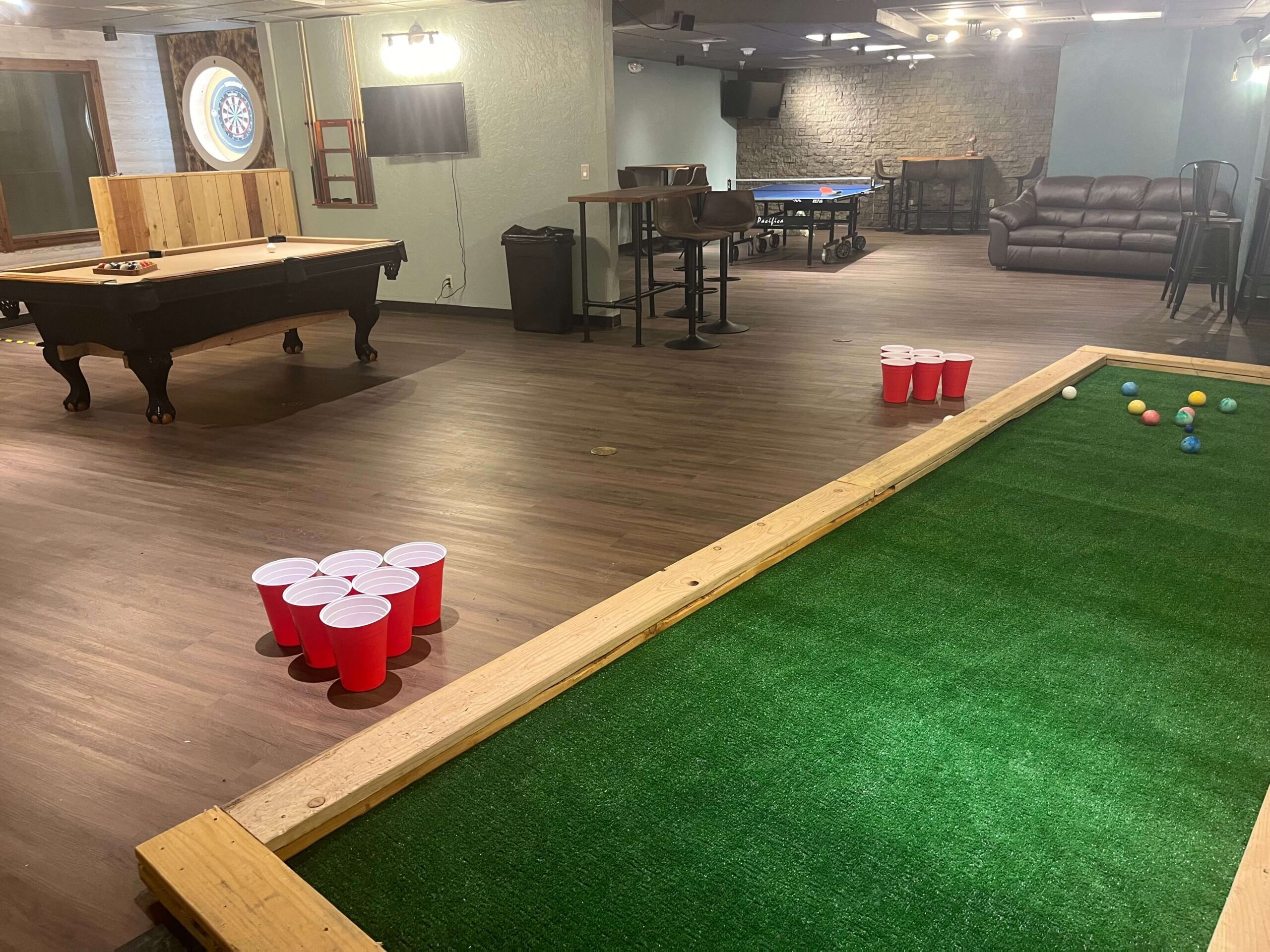 game lounge, ping pong, pool table, darts, fooseball